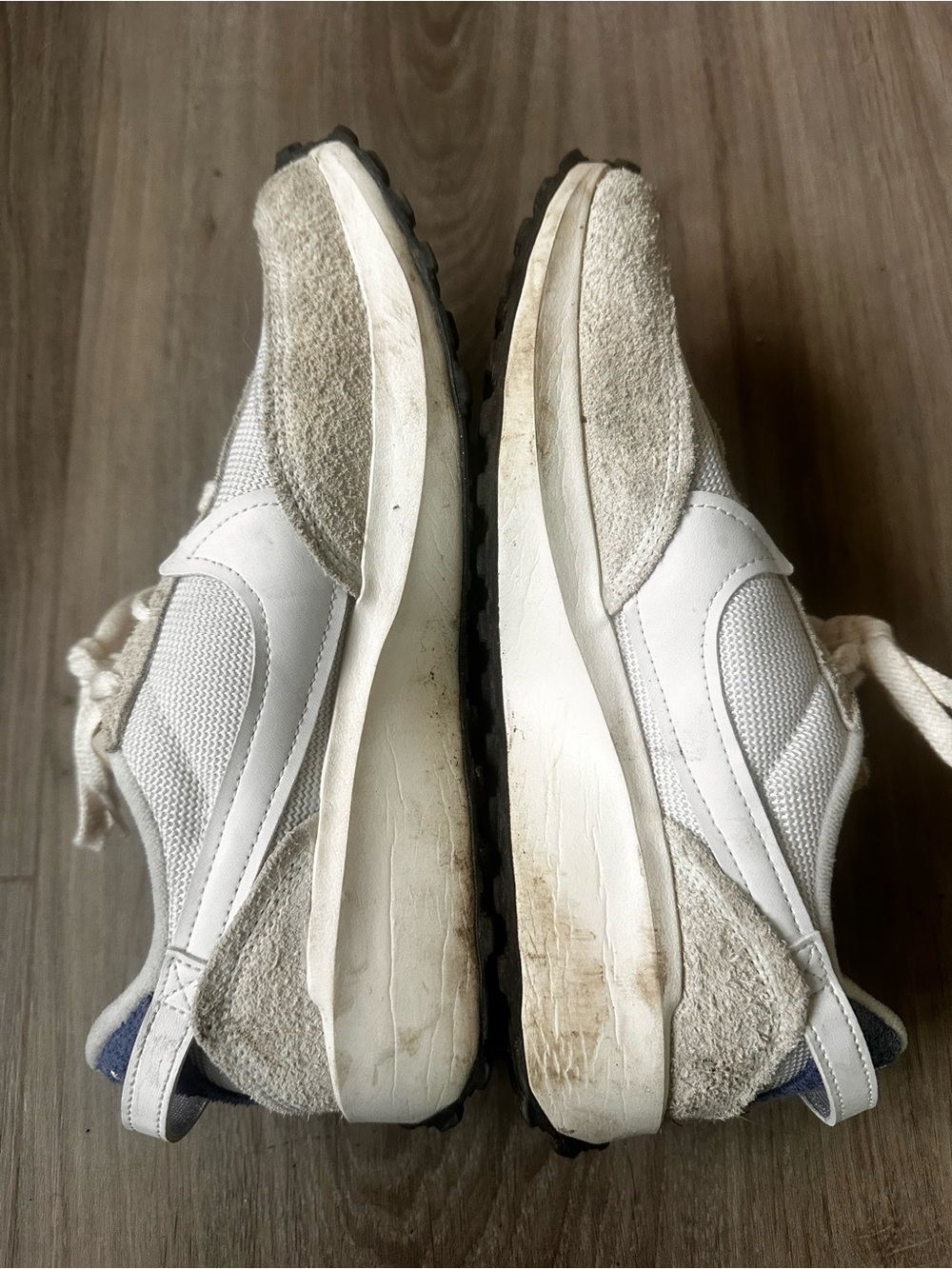 Nike Cream Running Shoes with White Swoosh and Blue Back.